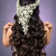 Model showcasing high-end bridal styling and complex curling techniques demonstrating the premium skills taught in the Advanced Hair Course in Aligarh.