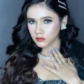 Student showcasing a glamorous look from our professional makeup artist course in Aligarh.